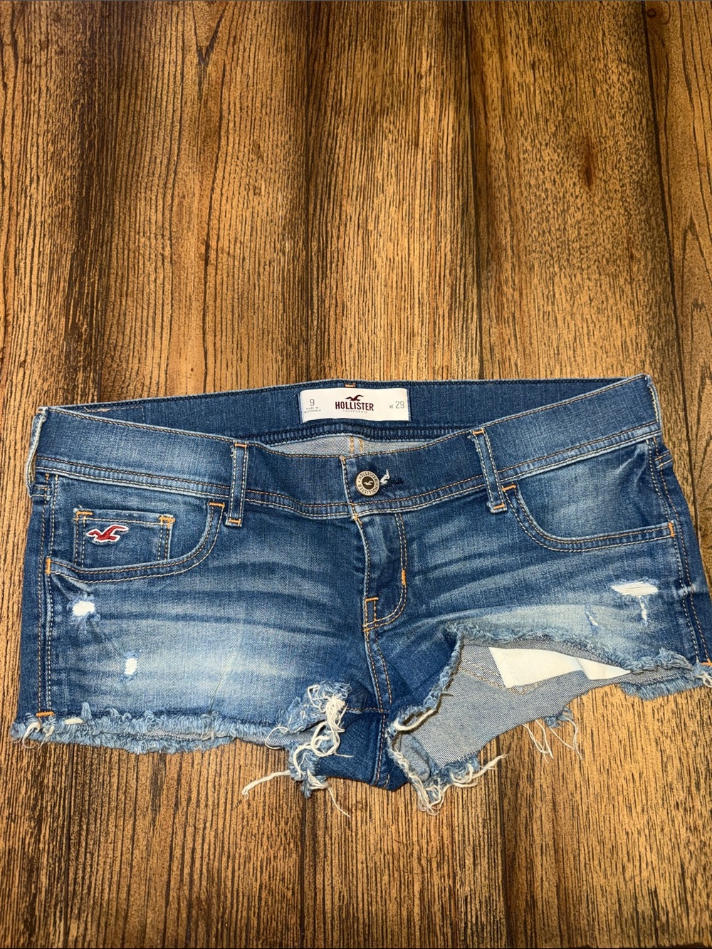 Hollister Cutoff Distressed Jean Shorts in Blue Wash